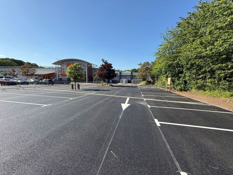 Freshly resurfaced retail car park with new white bay lines and arrows, marked by C&R