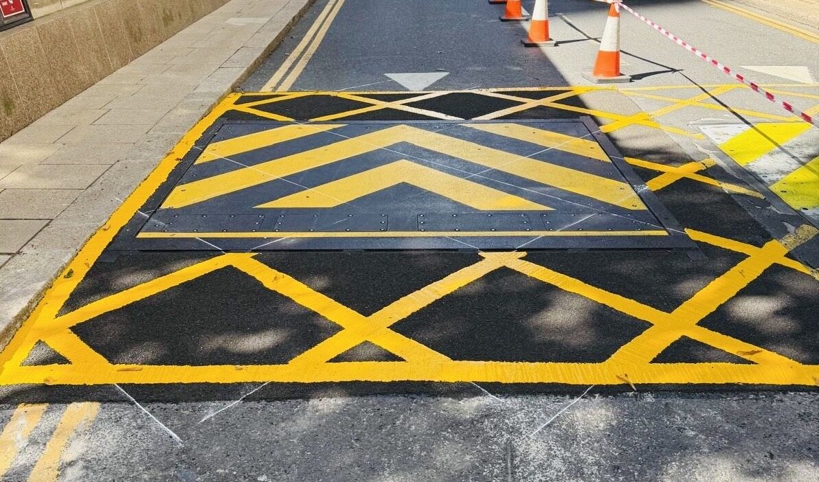Anti-skid surfacing and yellow hatched markings at Canary Wharf