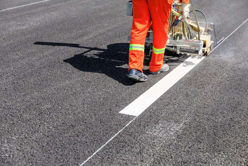 Painting white lines on a road