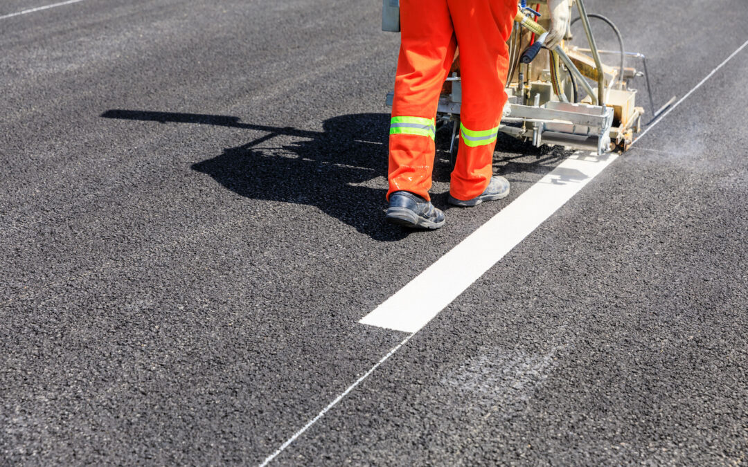 Painting white lines on a road