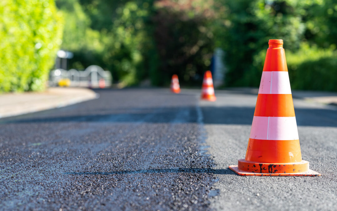 Traffic cones along a road being re-laid