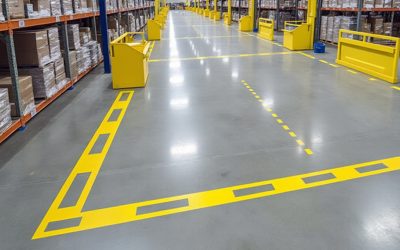 How is line marking removed from a warehouse floor and what is done with the waste?